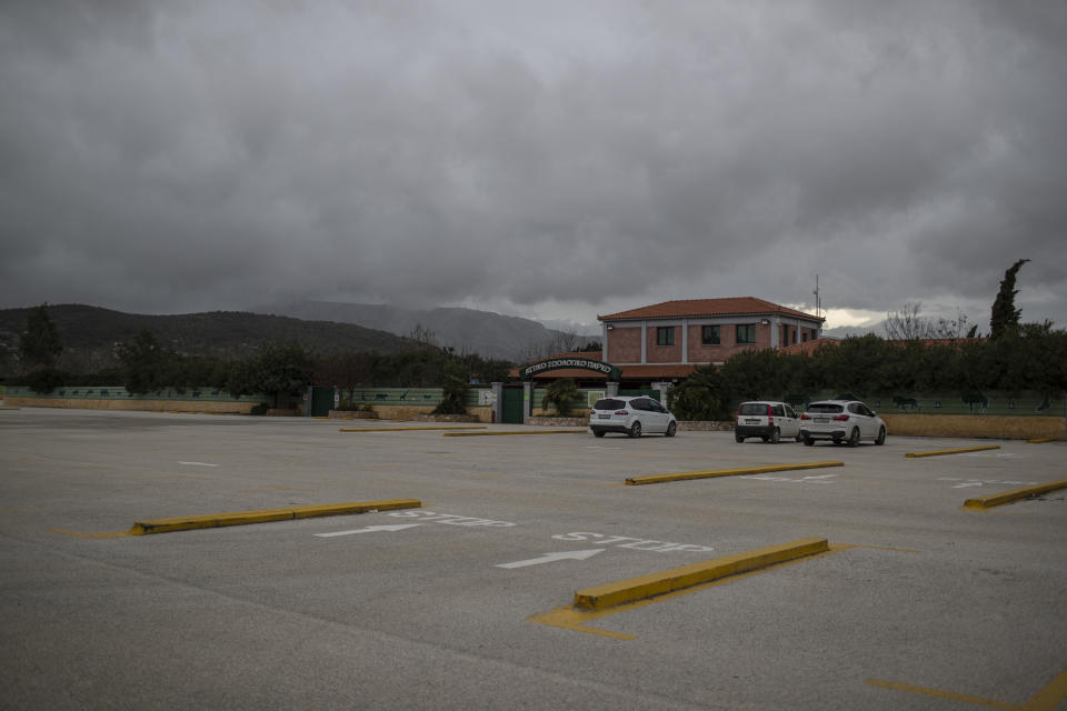 An almost empty parking lot of the Attica Zoological Park in Spata, near Athens, on Tuesday, Jan. 26, 2021. After almost three months of closure due to COVID-19, Greece's only zoo could be approaching extinction: With no paying visitors or state aid big enough for its very particular needs, it still faces huge bills to keep 2,000 animals fed and healthy. (AP Photo/Petros Giannakouris)