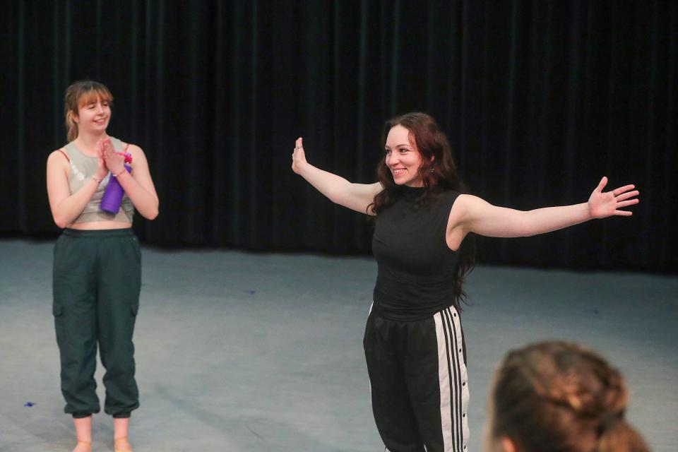 Visiting assistant professor Christine Howe talks with "Dance Sonata" performers after a joint rehearsal with a UA jazz trio and dancers on March 22 at Guzzetta Hall.