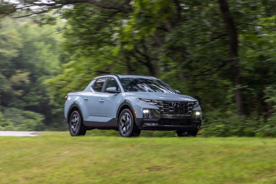 <p>Don't get it twisted: the new 2022 Hyundai Santa Cruz is a pickup truck. Its smaller proportions and unibody construction just mean it's no full-size tow rig, but we still like it enough to put it on our <a href="https://www.caranddriver.com/features/a38873223/2022-editors-choice/" rel="nofollow noopener" target="_blank" data-ylk="slk:Editors' Choice list;elm:context_link;itc:0;sec:content-canvas" class="link ">Editors' Choice list</a>. Instead, think of the first <a href="https://www.caranddriver.com/hyundai" rel="nofollow noopener" target="_blank" data-ylk="slk:Hyundai;elm:context_link;itc:0;sec:content-canvas" class="link ">Hyundai</a> pickup as an alternative to the <a href="https://www.caranddriver.com/honda/ridgeline" rel="nofollow noopener" target="_blank" data-ylk="slk:also-unibody Honda Ridgeline;elm:context_link;itc:0;sec:content-canvas" class="link ">also-unibody Honda Ridgeline</a>, which too features a one-size-fits-all crew cab, short-bed body style. The Santa Cruz certainly looks more distinct than the <a href="https://www.caranddriver.com/honda" rel="nofollow noopener" target="_blank" data-ylk="slk:Honda;elm:context_link;itc:0;sec:content-canvas" class="link ">Honda</a>–or any other mid-size truck, for that matter­–with its interesting face and creased sheetmetal. Its interior is snazzier than its classmates, too, but the lack of physical controls on some models is disappointing. Its standard four-cylinder engine is also undesirable, but the more powerful turbo option is a pricey proposition. Still, the 2022 Santa Cruz is a more functional twist on the tired crossover formula, and that open box on its butt means it qualifies as a pickup truck.</p><p><a class="link " href="https://www.caranddriver.com/hyundai/santa-cruz" rel="nofollow noopener" target="_blank" data-ylk="slk:Review, Pricing, and Specs;elm:context_link;itc:0;sec:content-canvas">Review, Pricing, and Specs</a></p>