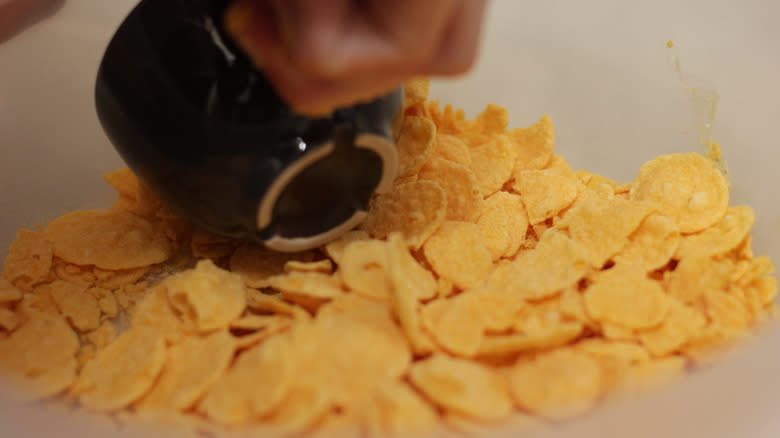 crushing cornflakes with cup 