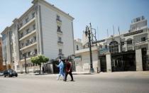 Members of medical team walk in front of the Institute of Research for Tropical Medicine amid concerns about the spread of the coronavirus disease (COVID-19), in Cairo