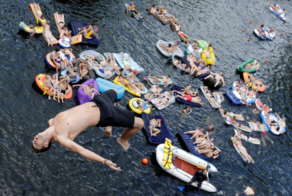 A man jumps into the water before a cliff diving competition