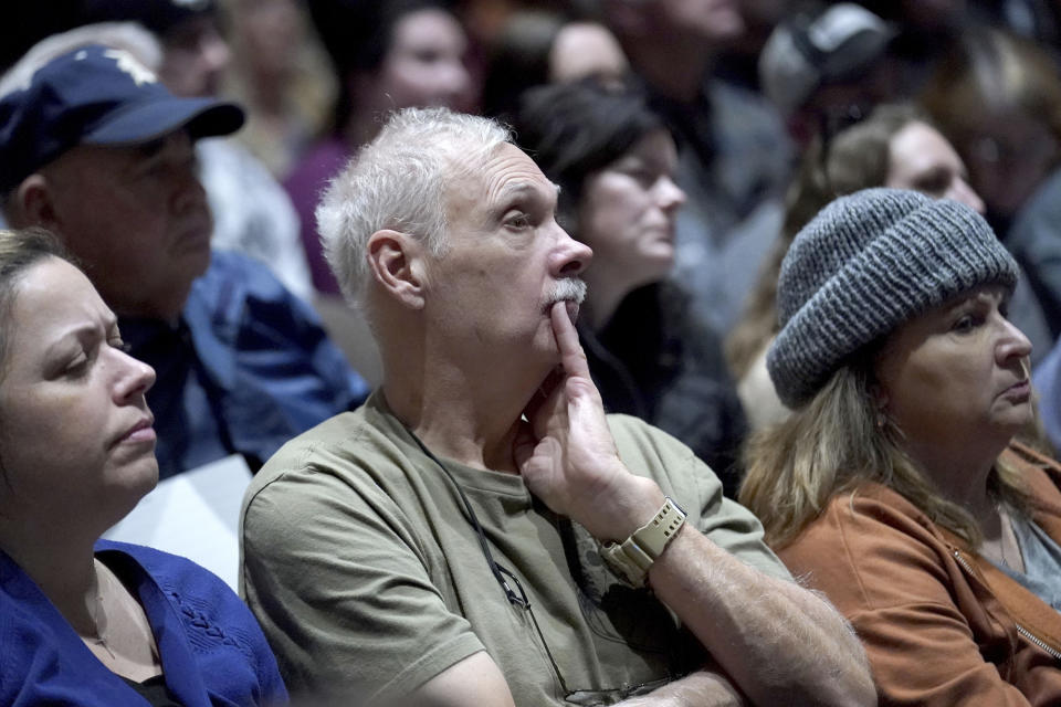 East Palestine residents listen to a town hall meeting at East Palestine High School concerning the Feb. 3 Norfolk Southern freight train derailment in East Palestine, Ohio, Friday, Feb. 24, 2023. (AP Photo/Matt Freed)