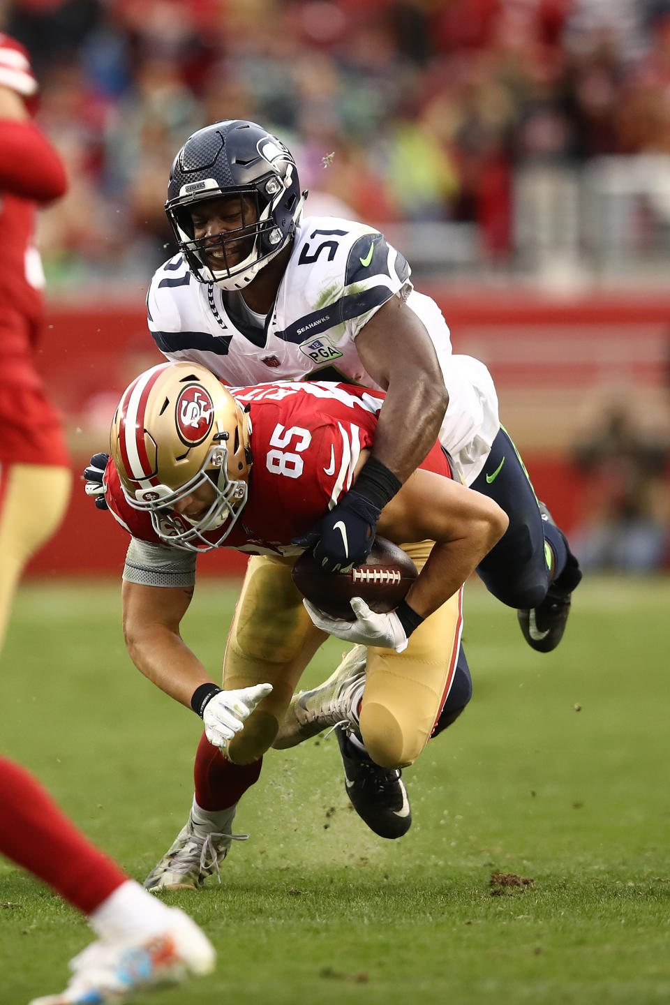 <p>George Kittle #85 of the San Francisco 49ers is tackled by Barkevious Mingo #51 of the Seattle Seahawks after a catch during their NFL game at Levi’s Stadium on December 16, 2018 in Santa Clara, California. (Photo by Ezra Shaw/Getty Images) </p>