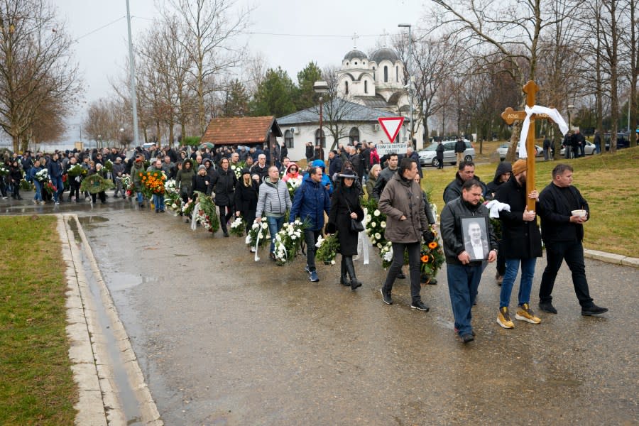 People attend the funeral of late Golden State Warriors assistant coach Dejan Milojević in Belgrade, Serbia, Monday, Feb. 12, 2024. Milojević, 46, died on Jan. 17, in Salt Lake City after heart attack. (AP Photo/Darko Vojinovic)