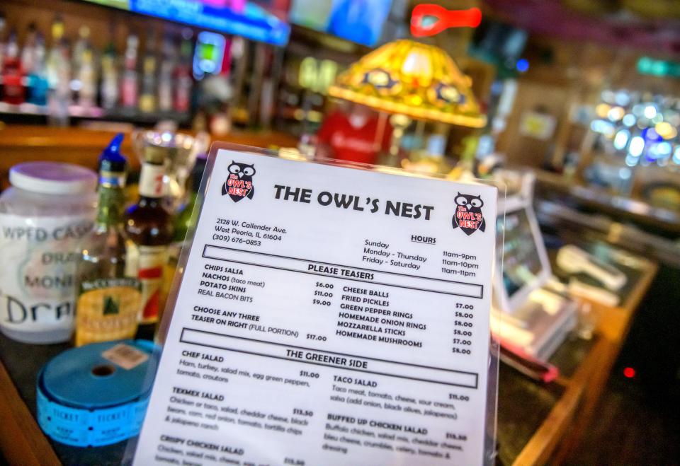 New menus at the Owl's Nest in West Peoria reflect an uptick in prices that owner Kirstie Doerr said she's tried hard to avoid.