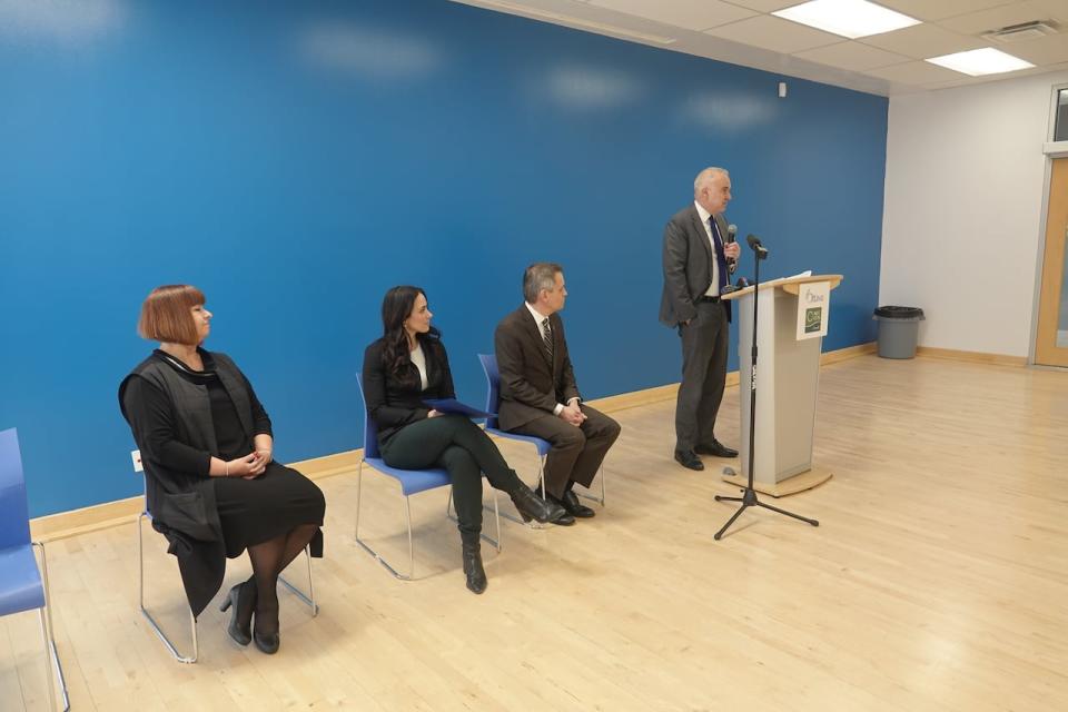 National Capital Commission CEO Tobi Nussbaum, right, speaks at the announcement of a memo of understanding between his organization and the City of Ottawa on travel changes through a part of the Greenbelt Feb. 28, 2024.