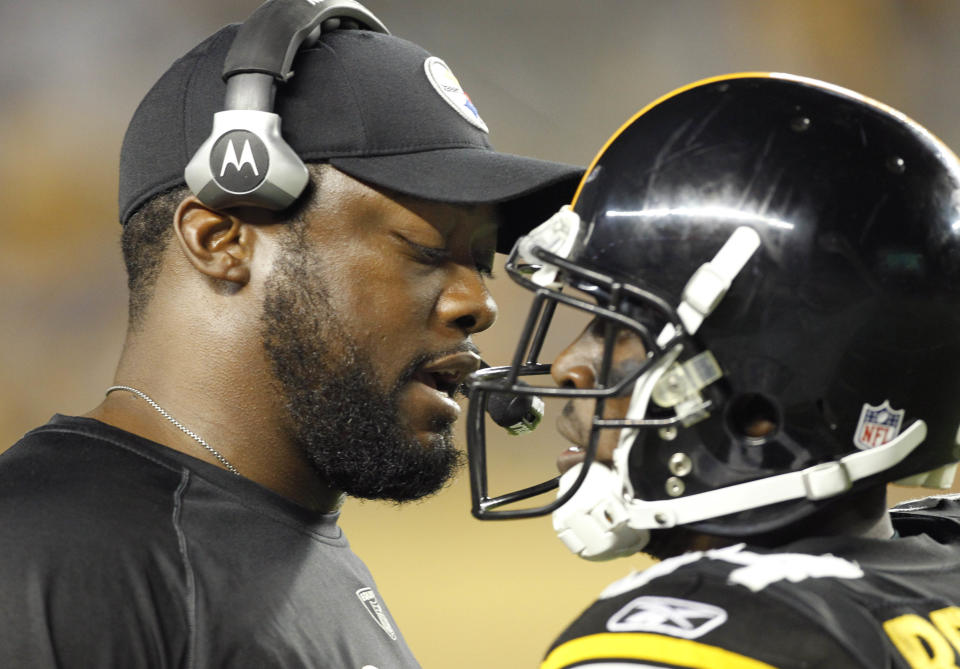 Pittsburgh Steelers head coach Mike Tomlin, left, talks with Steelers wide receiver Antonio Brown (84) after Brown made a 55-yard touchdown catch in the second quarter of the preseason NFL football game against the Atlanta Falcons on Saturday, Aug. 27, 2011, in Pittsburgh. (AP Photo/Keith Srakocic)