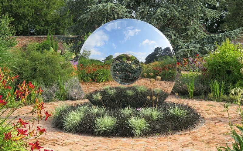 Two halves: guests can explore interesting and modern artwork at this beautifully presented garden in Gloucestershire - National Garden Scheme