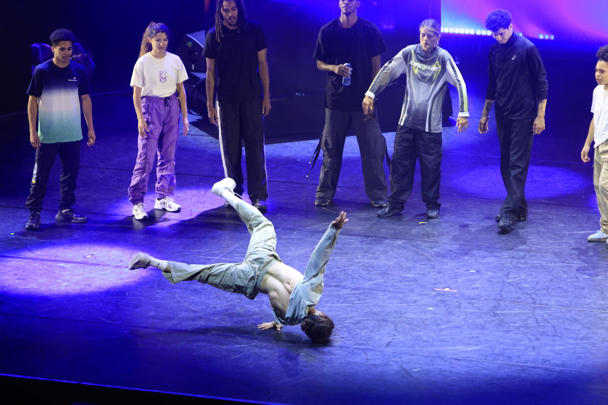 PARIS, FRANCE - JULY 22: A breakdancer performs on stage during the Battle BD and Breakdance during the Paris 2024 Cultural Olympiad at L'Olympia on July 22, 2024 in Paris, France. (Photo by Julien M. Hekimian/Getty Images)