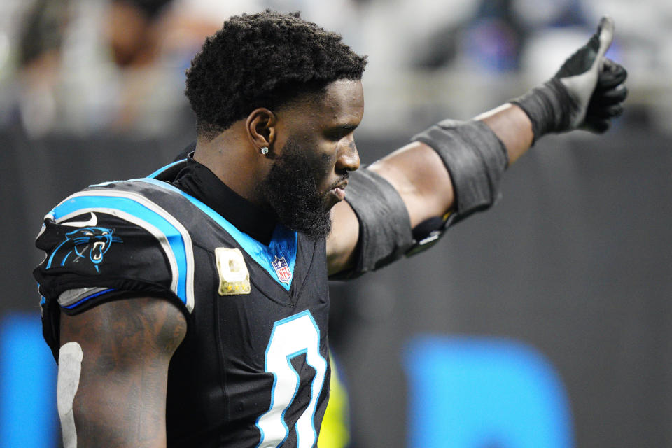 Carolina Panthers linebacker Brian Burns leaves the field after getting hurt during the second half of an NFL football game against the Indianapolis Colts Sunday, Nov. 5, 2023, in Charlotte, N.C. (AP Photo/Jacob Kupferman)