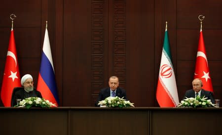 Turkish President Erdogan speaks during a joint news conference with his counterparts Rouhani of Iran and Putin of Russia in Ankara