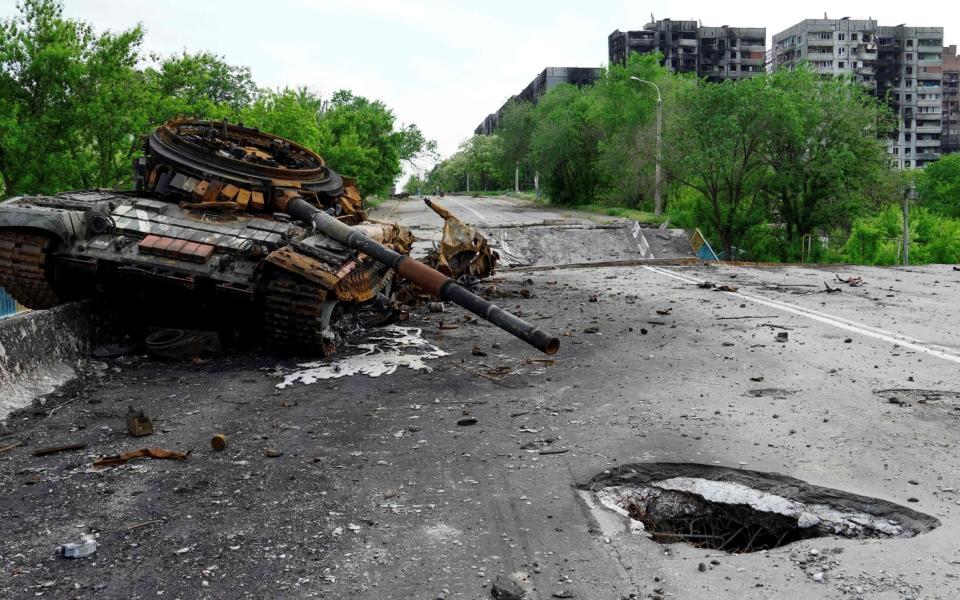 A destroyed tank is pictured in Mariupol - STRINGER/AFP