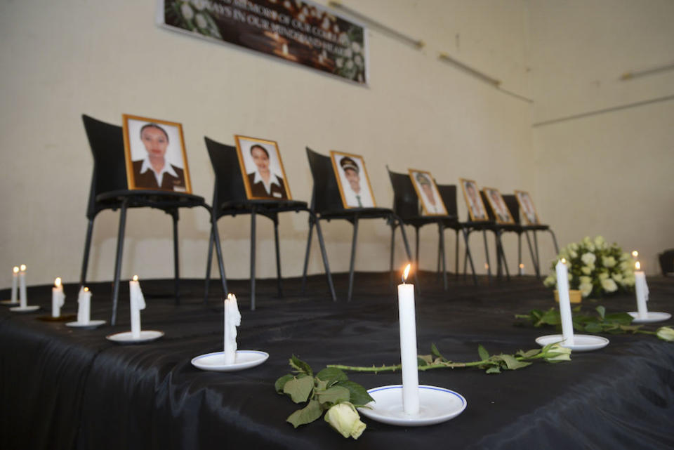 Framed photographs of seven crew members are displayed at a memorial service held by an association of Ethiopian airline pilots (Picture: AP)