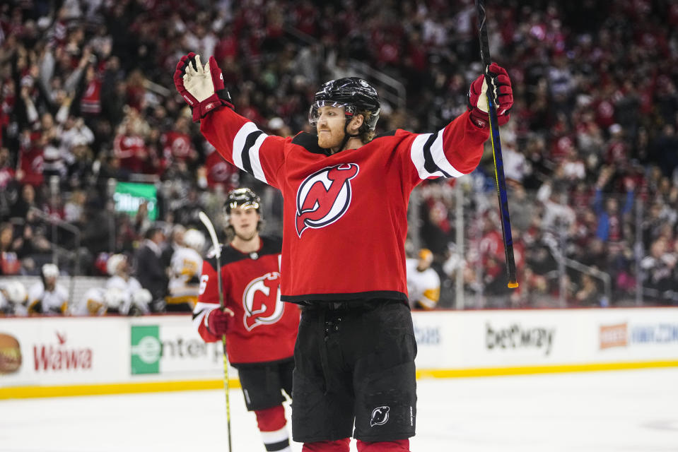 New Jersey Devils' Dougie Hamilton celebrates after scoring the game-winning goal during the overtime period of an NHL hockey game, Sunday, Jan. 22, 2023, in Newark, N.J. The Devils won 2-1. (AP Photo/Frank Franklin II)