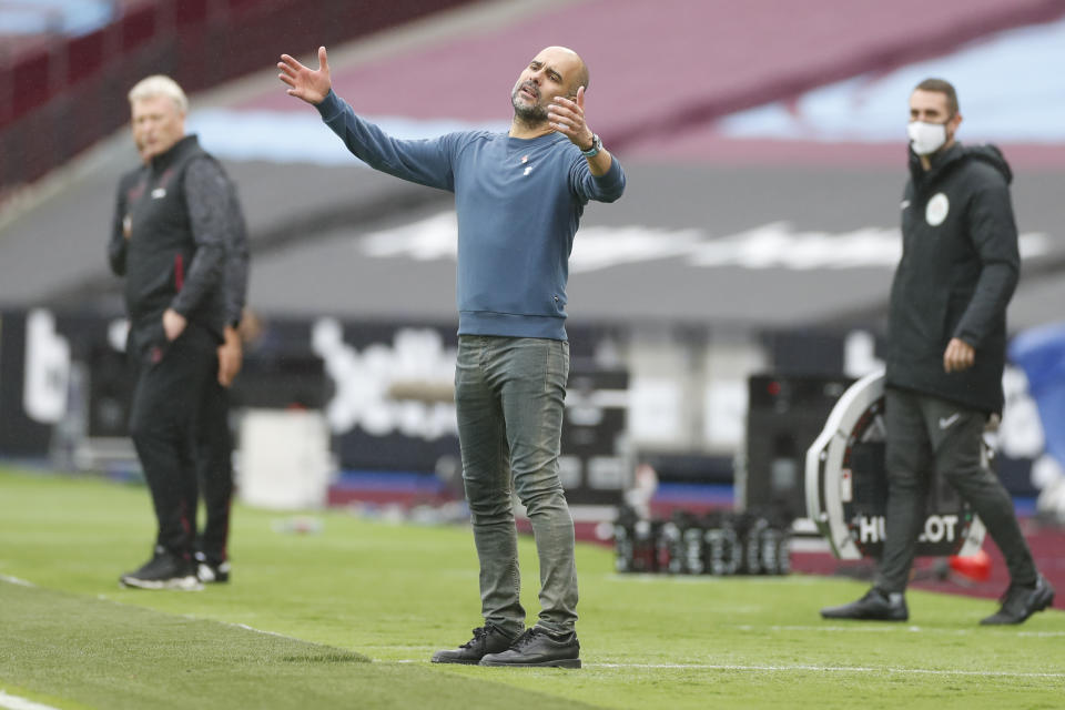 Manchester City's head coach Pep Guardiola reacts during the English Premier League soccer match between West Ham and Manchester City, at the London Olympic Stadium Saturday, Oct. 24, 2020. (Paul Childs, Pool via AP)