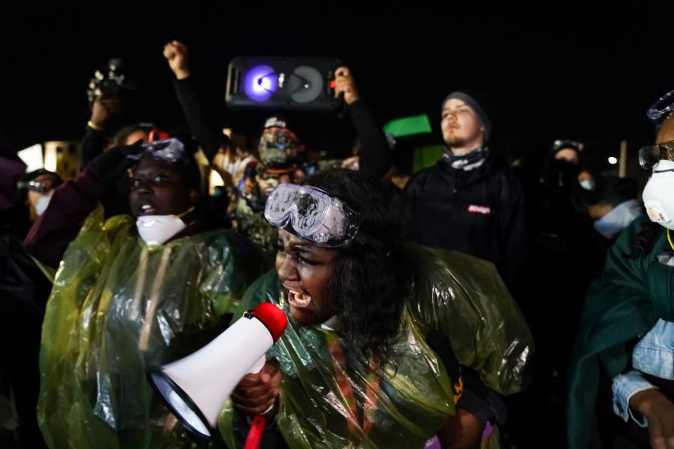 Protesters gather outside the Brooklyn Center Police Department in response to the police killing of Daunte Wright