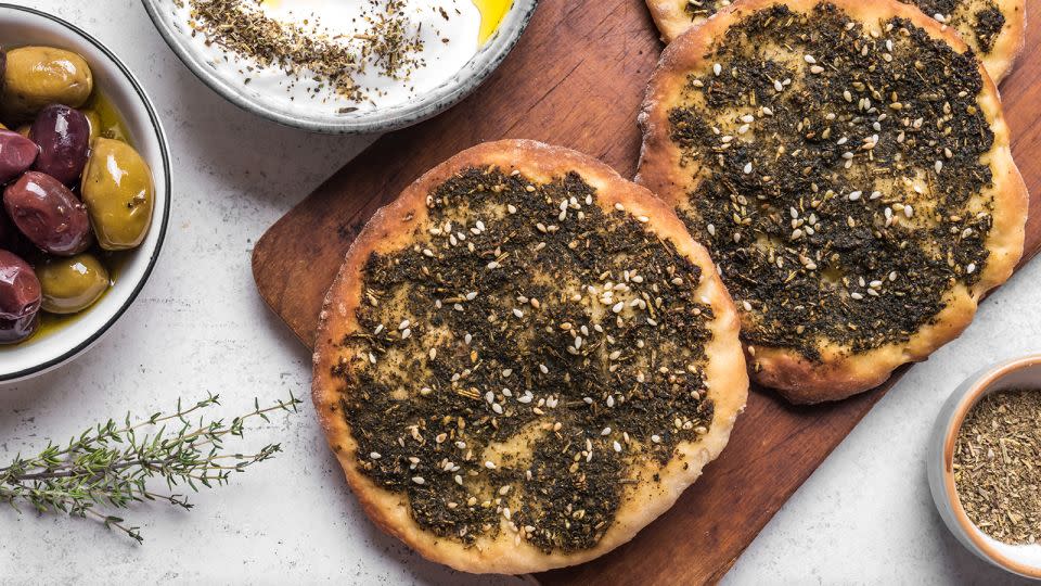 Za’atar, a blend of sumac, toasted sesame seeds, wild thyme and other spices, enhances manakeesh, a flatbread similar to pizza. - Mizina/Getty Images