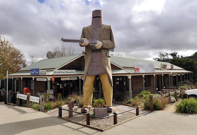 A giant statue of Australian outlaw Ned Kelly at Glenrowan, the location of his final stand, about 175 kilometres north of Melbourne, on May 26, 2009. Australian outlaw Ned Kelly was finally laid to rest in a rural cemetery beside his mother Sunday, with his grave unmarked and sealed beneath layers of concrete to guard against souvenir-taking