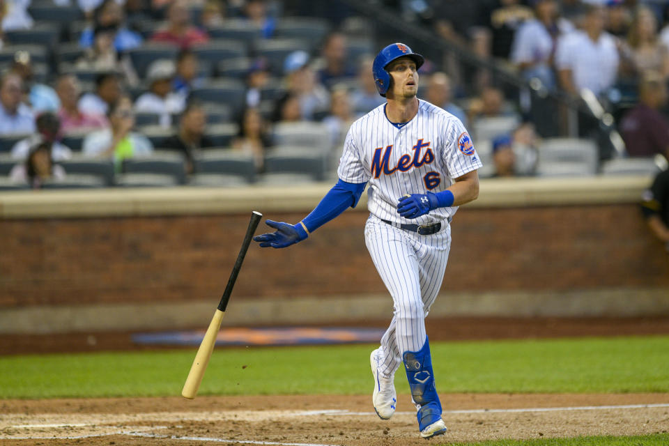 New York Mets' Jeff McNeil drops his bat after hitting a three-run home run, also scoring Amed Rosario and Zack Wheeler, during the third inning of a baseball game against the Pittsburgh Pirates, Friday, July 26, 2019, in New York. (AP Photo/Corey Sipkin)
