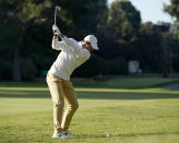 Rory McIlroy, of Northern Ireland, hits his second shot on the 13th hole during the first round of the Genesis Invitational golf tournament at Riviera Country Club, Thursday, Feb. 13, 2020, in the Pacific Palisades area of Los Angeles. (AP Photo/Ryan Kang)