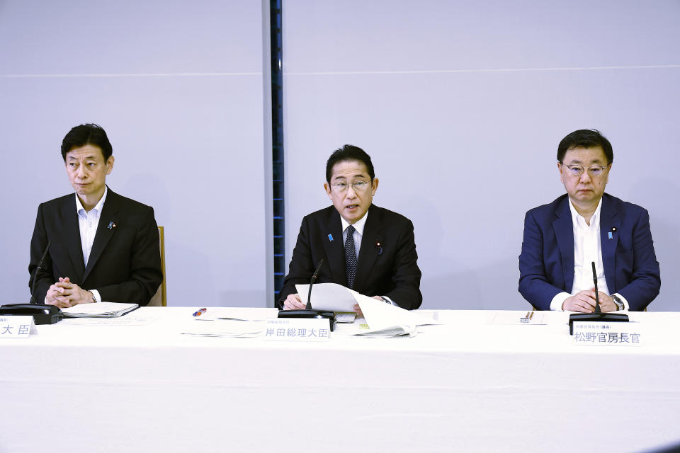 Japanese Prime Minister Fumio Kishida, center, speaks during a meeting with representatives of the Inter-Ministerial Council for Contaminated Water, Treated Water and Decommissioning Issues and the Inter-Ministerial Council Concerning the Continuous Implementation of the Basic Policy on Handling of Advanced Liquid Processing System (ALPS) Treated Water, at the prime minister's office in Tokyo Tuesday, Aug. 22, 2023. (Rodrigo Reyes Marin/Pool Photo via AP)