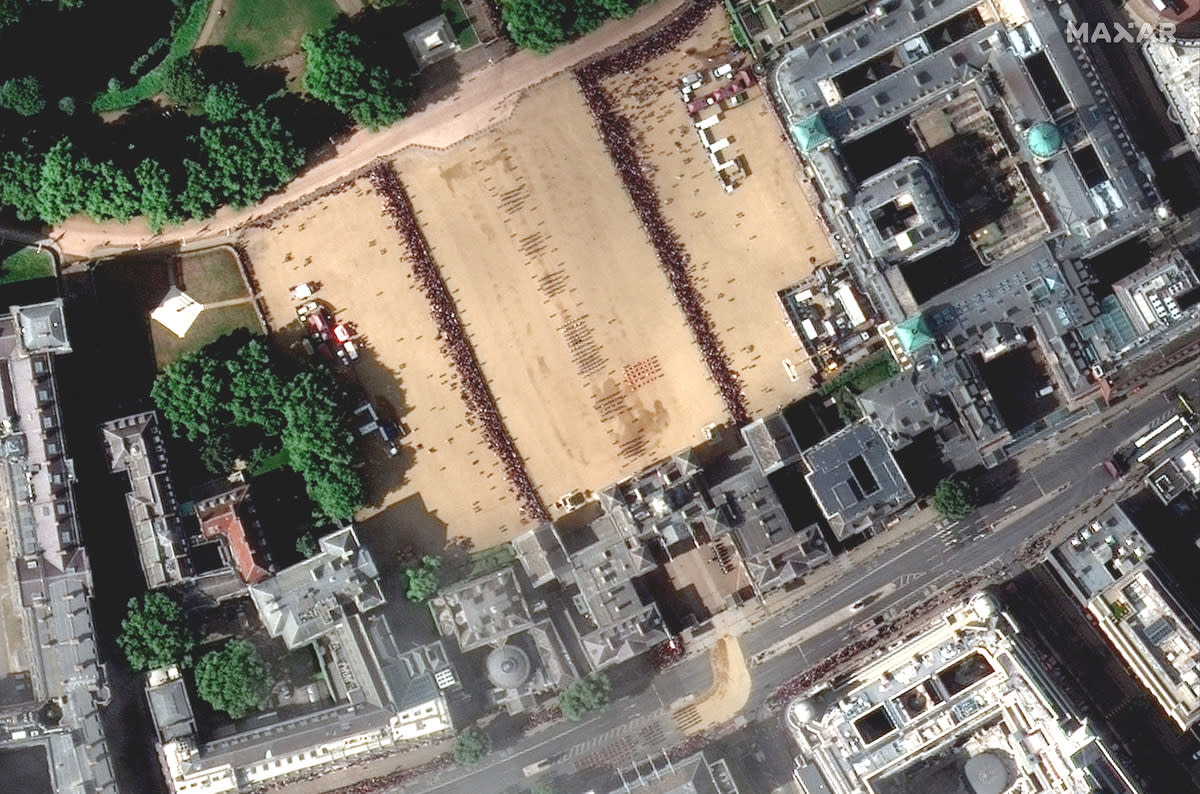 A satellite image shows the procession for late Queen Elizabeth and crowds at horse guards parade, in London, Britain September 19, 2022. Courtesy of 2022 Maxar Technologies/Handout via REUTERS. ATTENTION EDITORS - THIS IMAGE HAS BEEN SUPPLIED BY A THIRD PARTY. MANDATORY CREDIT. NO RESALES. NO ARCHIVES. MUST NOT OBSCURE LOGO.