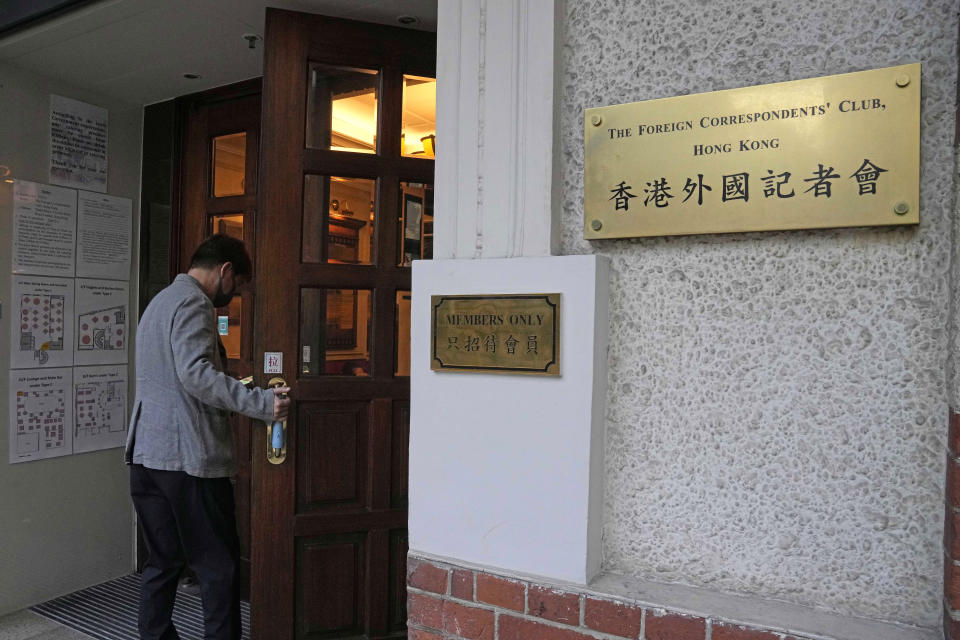 A man enters the Hong Kong Foreign Correspondents' Club in Hong Kong, Friday, Nov. 5, 2021. China has criticized a press freedom survey, Friday, from the Hong Kong Foreign Correspondents' Club that found nearly half its members were considering leaving the city. The survey said the members are concerned about a decline in press freedoms under a sweeping new national security law imposed by Beijing following massive anti-government protests in 2019. (AP Photo/Kin Cheung)