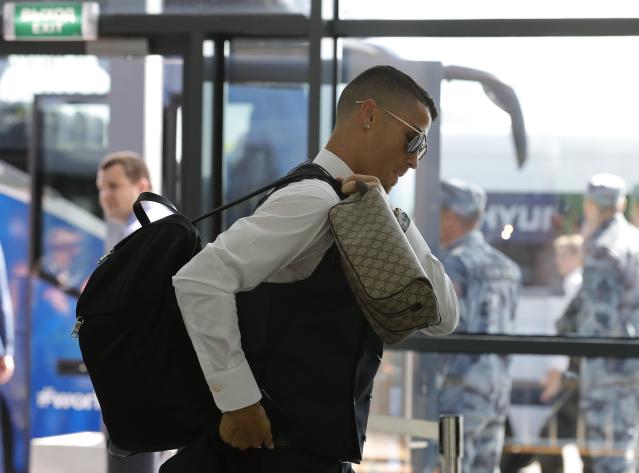 Cristiano Ronaldo spotted looking glum at Moscow airport as he