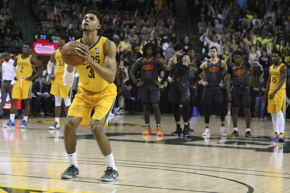 Baylor guard MaCio Teague shoots a pair of free throws after a technical foul against Oklahoma State during the second half of an NCAA college basketball game Saturday, Feb. 8, 2020, in Waco, Texas. (AP Photo/Rod Aydelotte)