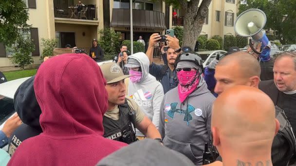 PHOTO: Police try to keep opposing sides apart outside the Glendale School District Building in Los Angeles County, Calif., June 6, 2023, where a district meeting on LGBTQ Studies was being held. (Sergio Olmos via Storyful)