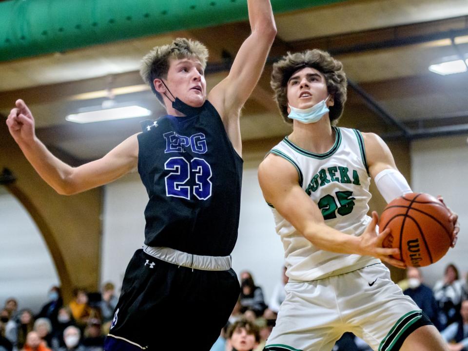 Eureka's Trevor Heffren, right, moves to the basket against El Paso-Gridley's Jake Funk in the first half Friday, Jan. 7, 2022 at Eureka High School. The Hornets fell to the Titans 55-46.