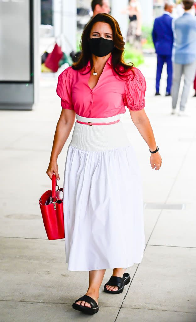 <p>Another Charlotte York outfit spotted on set is this fuchsia pink puff sleeved shirt, paired with a high-waist white Alexander McQueen cotton skirt (which, surprisingly, is not yet sold out online). She is carrying a Louis Vuitton bag and later changed into some Stuart Weitzman pink pumps for shooting, according @justlikethatcloset.</p><p><a class="link " href="https://www.selfridges.com/GB/en/cat/alexander-mcqueen-hybrid-high-waist-cotton-and-stretch-woven-midi-skirt_R03762126/" rel="nofollow noopener" target="_blank" data-ylk="slk:SHOP NOW;elm:context_link;itc:0;sec:content-canvas">SHOP NOW</a> Alexander McQueen Hybrid high-waist cotton and stretch-woven midi skirt, £1270</p>