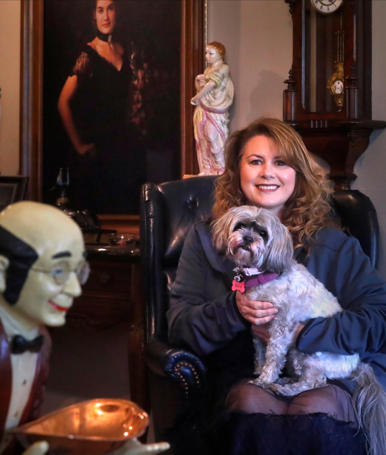 Peggy Flitcraft and her dog, Belle, who both survived a tornado that leveled her home in the Readyville community in Rutherford County, Tennessee, nearly a year ago, sit in Paul Vaughn's Studio and home where Flitcraft works, on Thursday, March 28, 2024, in Readyville. Flitcraft, Belle and her 30-year-old autistic son, Robby, were trapped under their destroyed 120-year-old historic home until all three crawled out with help of rescuers.