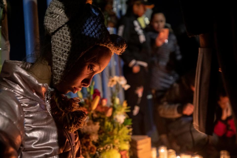 Migrants hold a vigil at the gate of the Mexican migrant facility where 39 migrants lost their lives after the facility caught fire where they had been detained. 