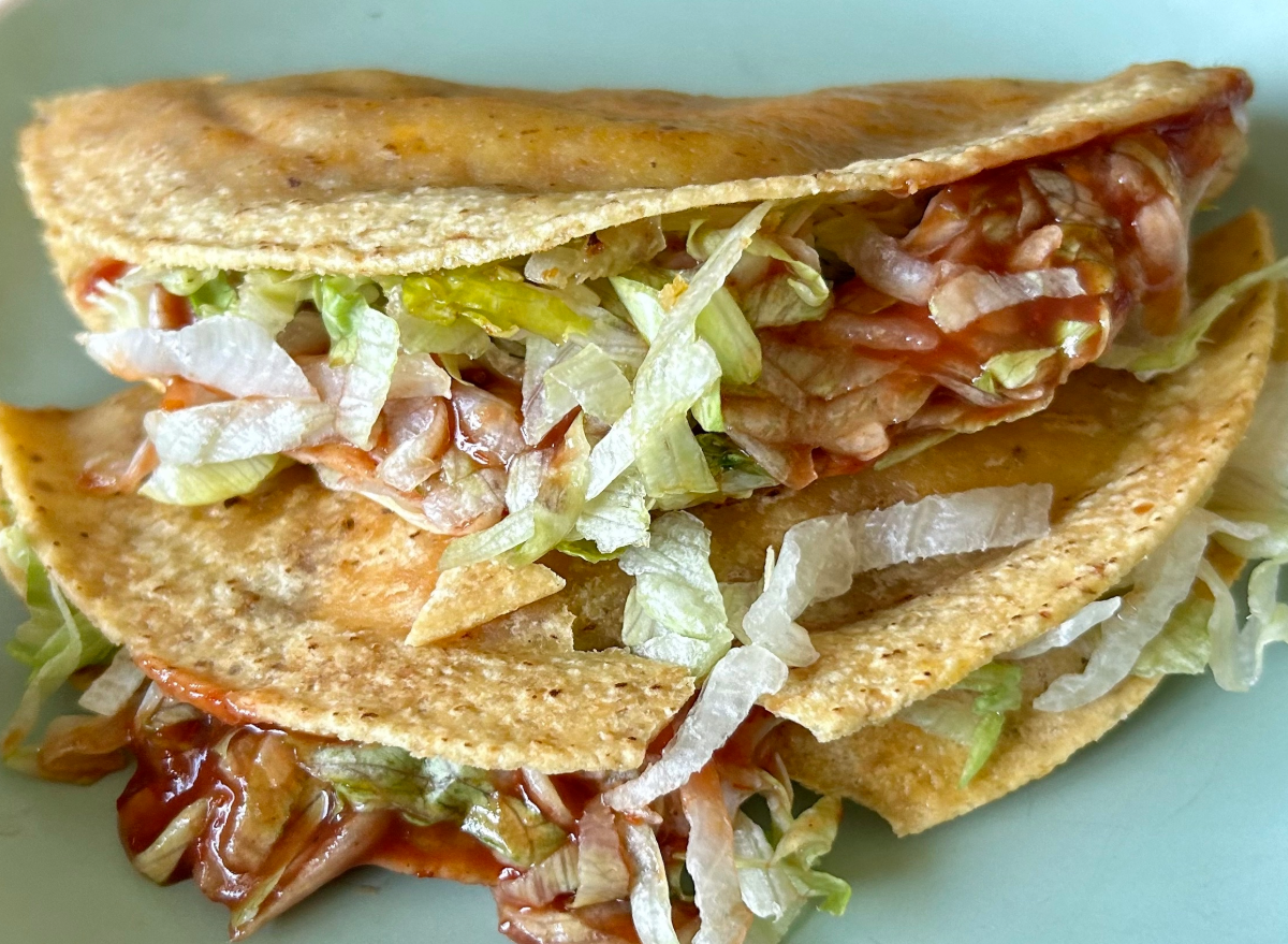 two jack in the box tacos on a plate.