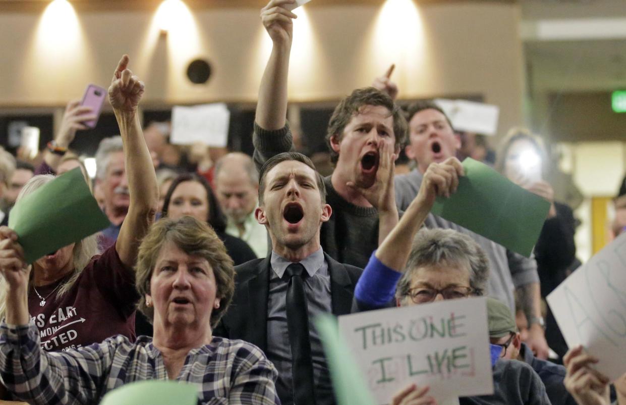 People shout at Representative Jason Chaffetz during his town hall meeting at Brighton High School on February 9, 2017 in Cottonwood Heights, Utah: Rick Bowmer/AP