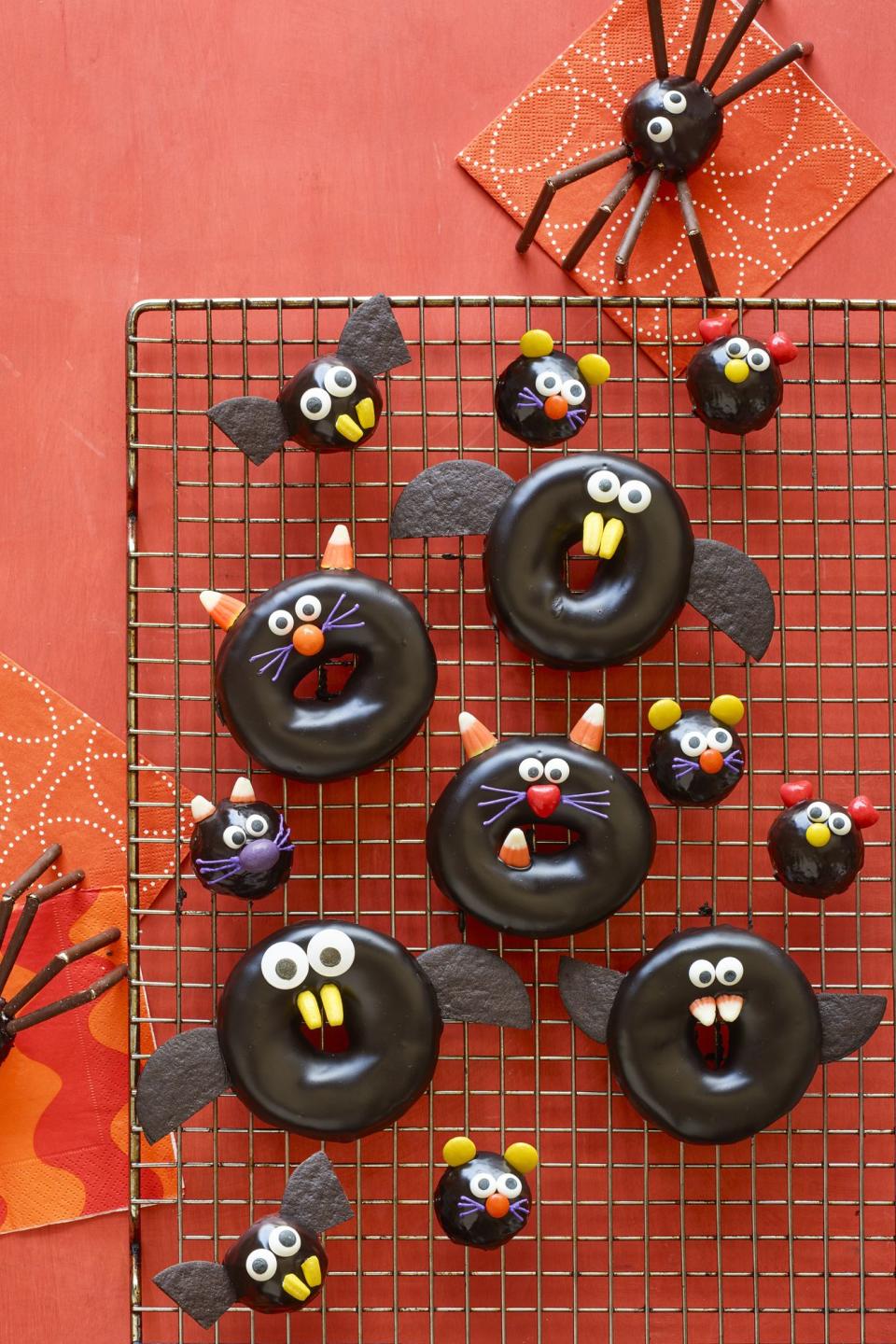 <p>These chocolate-covered Halloween treats double as a<a rel="nofollow noopener" href="https://www.womansday.com/home/crafts-projects/g2490/halloween-kids-crafts/" target="_blank" data-ylk="slk:kid's craft;elm:context_link;itc:0;sec:content-canvas" class="link "> kid's craft</a>.</p><p><strong><a rel="nofollow noopener" href="https://www.womansday.com/food-recipes/food-drinks/a23460042/black-cat-bat-spider-and-mice-doughnuts-recipe/" target="_blank" data-ylk="slk:Get the recipe;elm:context_link;itc:0;sec:content-canvas" class="link ">Get the recipe</a>. </strong></p>