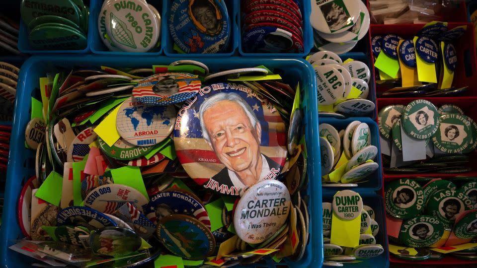 Campaign buttons for former President Jimmy Carter and others are seen in February in Plains. - Brendan Smialowski/AFP/Getty Images