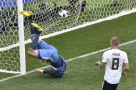 <p>Germany’s goalkeeper Manuel Neuer (L) concedes a goal during the Russia 2018 World Cup Group F football match between Germany and Mexico at the Luzhniki Stadium in Moscow on June 17, 2018. (Photo by Mladen ANTONOV / AFP) </p>