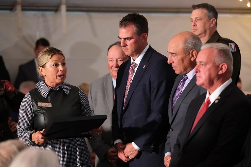 Jamie Crow, with the South OKC Chamber of Commerce, reads a proclamation. The Steven A. Cohen Military Family Clinic at Red Rock grand opening ceremony for the Oklahoma City location, Tuesday, Oct. 24, 2023