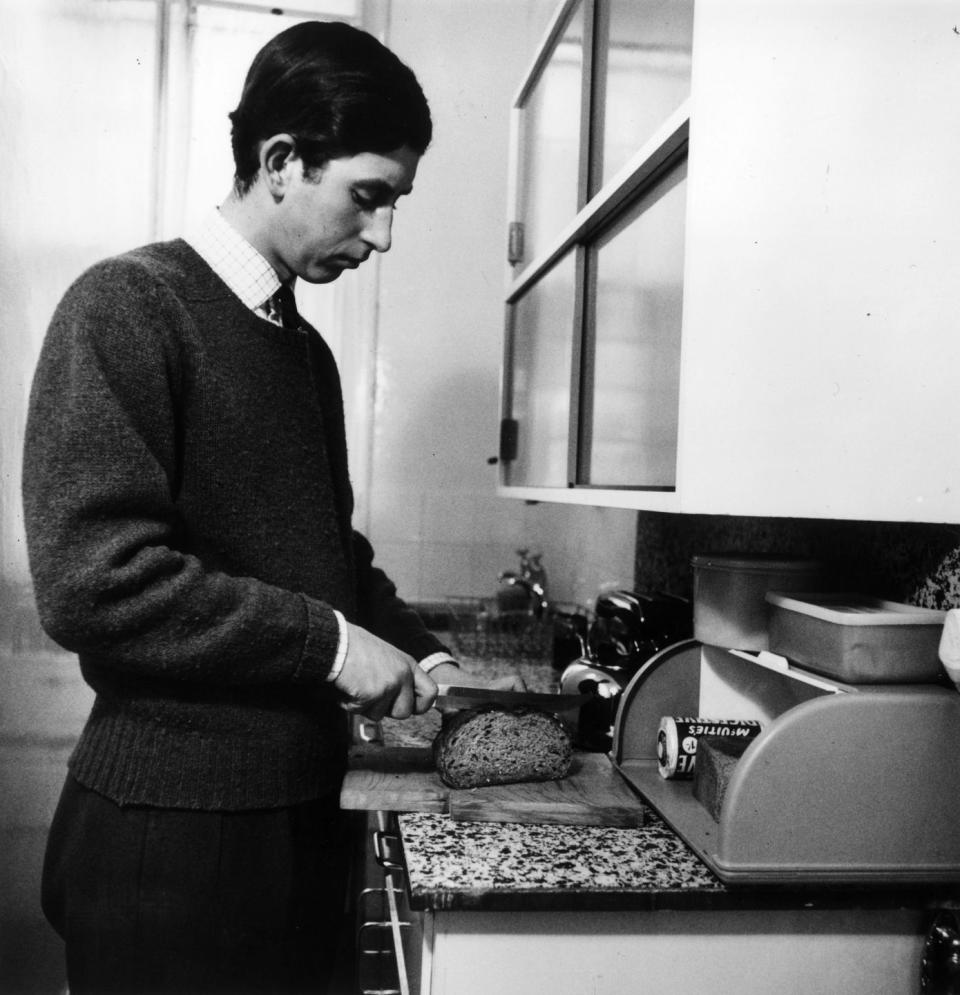 Prince Charles slicing bread in his apartment