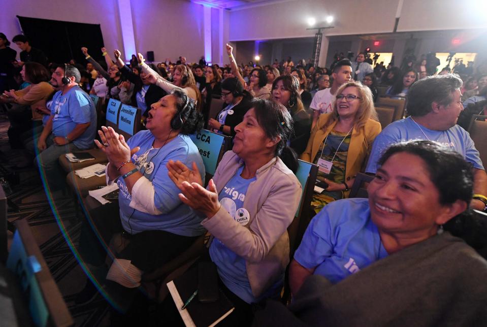 Migrant rights activists cheer as Democratic presidential candidites address migrant-rights organizations at the 'Unity Freedom Presidential Forum' in Pasedena, California on May 31, 2019. - Democratic presidential contenders, Kamala Harris, Bernie Sanders, former US Secretary of Housing and Urban Development Julian Castro and Washington Gov. Jay Inslee attended the event.