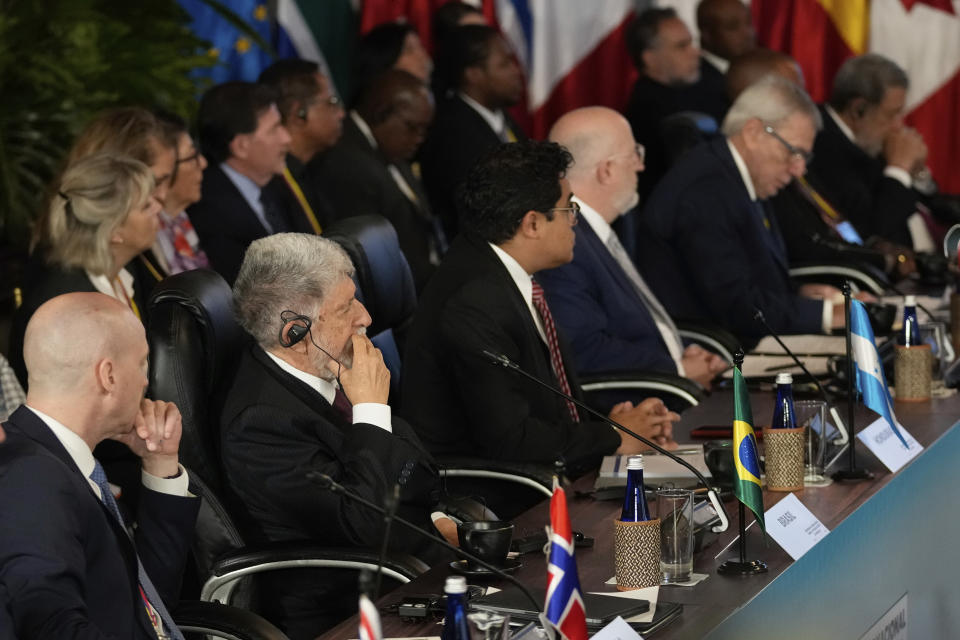 Celso Luiz Nunes Amorim, Brazilian presidential chief advisor, second left, attends an international conference focused on Venezuela's political crisis, at the San Carlos Palace, also known as the Foreign Ministry, in Bogota, Colombia, Tuesday, April 25, 2023. Organized by Colombian President Gustavo Petro, the conference is meant to jumpstart official dialogue between the Venezuelan government and its adversaries, as it promotes that the U.S. lifts some sanctions against the President Nicolas Maduro government. (AP Photo/Fernando Vergara)