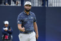 Spain's Jon Rahm celebrates on the 18th green during the third day of the British Open Golf Championships at the Royal Liverpool Golf Club in Hoylake, England, Saturday, July 22, 2023. (AP Photo/Jon Super)