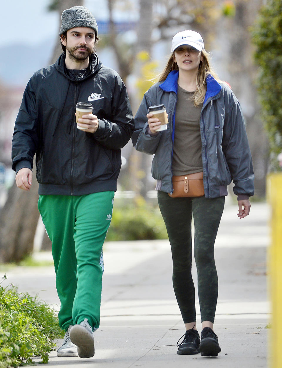<p>Elizabeth Olsen and fiancé Robbie Arnett take a coffee break in L.A. on Saturday.</p>