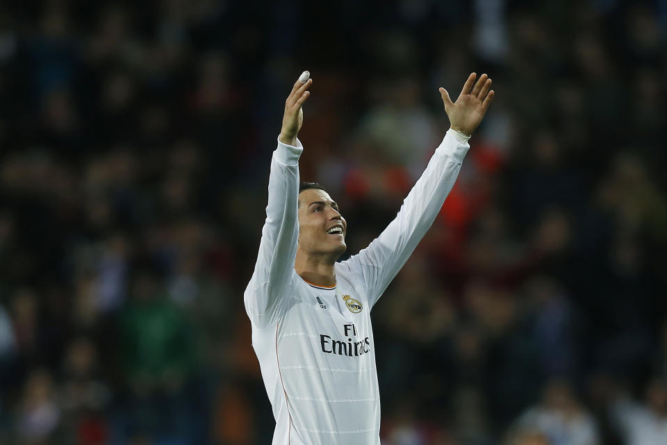 Real's Cristiano Ronaldo celebrates his second goal during a Spanish La Liga soccer match between Real Madrid and Osasuna at the Santiago Bernabeu stadium in Madrid, Spain, Saturday, April 26, 2014. (AP Photo/Andres Kudacki)