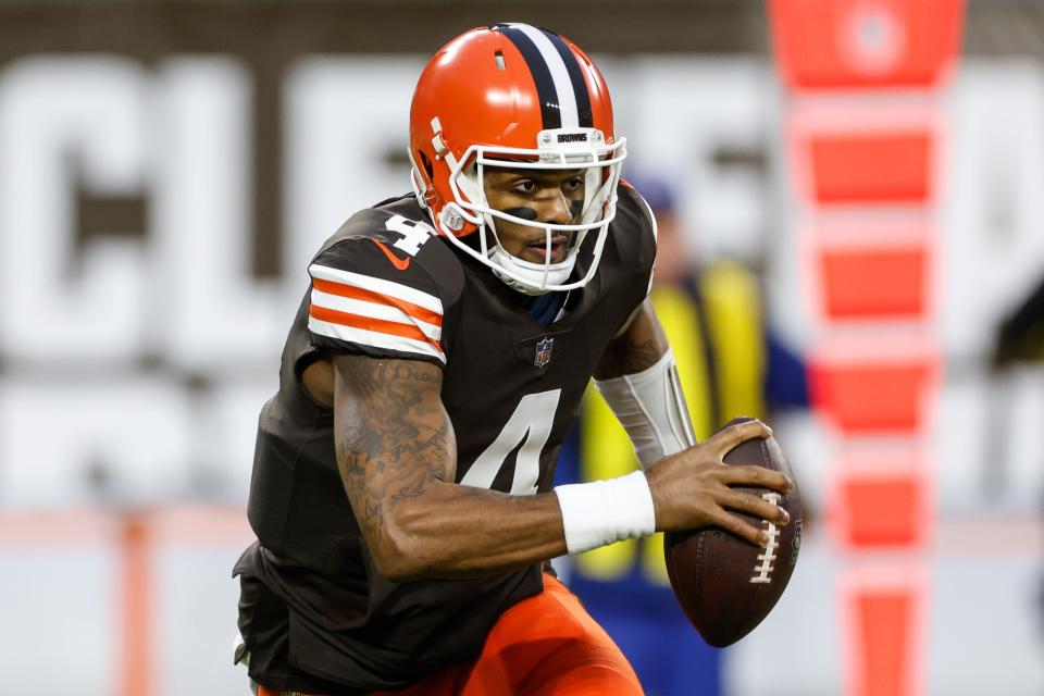 Cleveland Browns quarterback Deshaun Watson carries the ball during the first half of an NFL football game against the Baltimore Ravens, Saturday, Dec. 17, 2022, in Cleveland. (AP Photo/Ron Schwane)