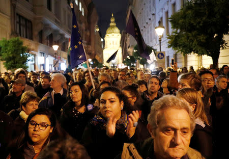 People attend a rally outside George Soros's Central European University to protest against the university being forced out of Budapest by Prime Minister Viktor Orban's government in Budapest, Hungary, October 26, 2018. REUTERS/Bernadett Szabo