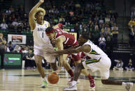 Stanford forward Jaiden Delaire, center Baylor guard Dale Bonner, right, reach for the ball while driving against Baylor forward Jeremy Sochan in the first half of an NCAA college basketball game, Saturday, Nov. 20, 2021, in Waco, Texas. (AP Photo/Jerry Larson)